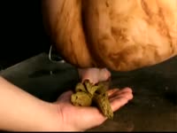 Scat fetish movie features guy catching poop as it falls from midgets ass so they can kiss with it